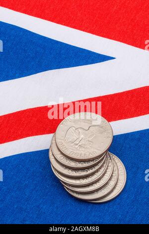 US $1 coins / Silver Dollars & Union Jack. For US Dollar exchange rate concept, US economy, US UK exports, US UK balance of payments, US Holiday money Stock Photo