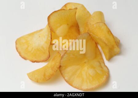 Keripik singkong or Cassava chips are snacks made from sliced cassava and then fried.isolated on white background Stock Photo