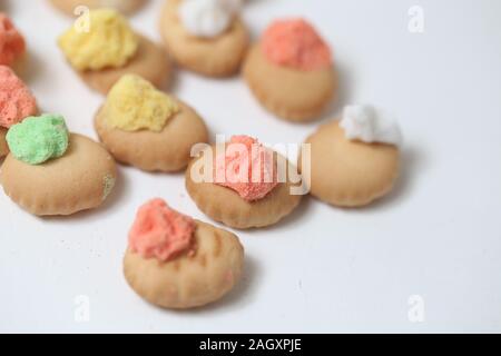 Belly button iced gem biscuits on white background Stock Photo