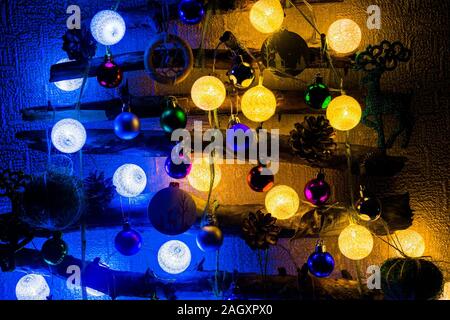 Christmas tree made from sticks and twigs background and Christmas decorations sparkling, glowing. Happy New Year and Merry Christmas. Stock Photo