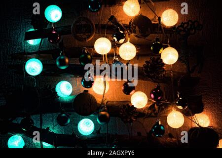 Christmas tree made from sticks and twigs background and Christmas decorations sparkling, glowing. Happy New Year and Merry Christmas. Stock Photo