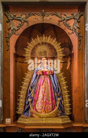 Wooden Virgin statue in the Parroquia de Santa María la Mayor (Saint Mary Major Parish) in Ronda. Malaga, Andalusia, Spain. June-03-2019 Stock Photo