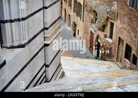 Siena, Italy - 03 March, 2019: Detail of the external marble staircase of the Duomo of the city