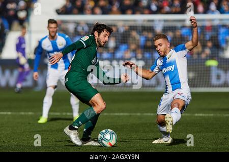 Kevin Rodrigues of CD Leganes and Esteban Granero of RCD Espanyol are seen in action during the La Liga match between CD Leganes and RCD Espanyol at Butarque Stadium in Leganes.(Final score: CD Leganes 2:0 RCD Espanyol) Stock Photo