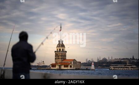 ISTANBUL, TURKEY - DEC, 15: Unidentified people fishing on Maiden's Tower at the coast on December 15, 2019 in Istanbul, Turkey. Stock Photo