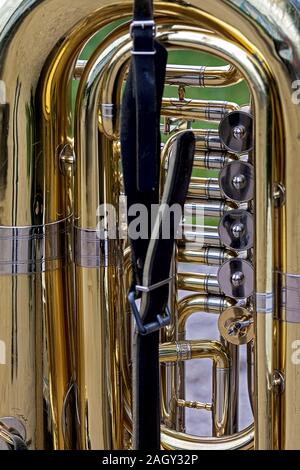 close up part of a golden colored shiny tuba Stock Photo