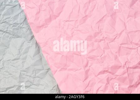 Pastel pink and light grey crumpled wrinkled paper texture background Stock Photo