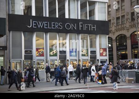 Crowds shopping on 'Black Friday' along 5th Avenue kicking off the holiday shopping season in midtown Manhattan. Stock Photo