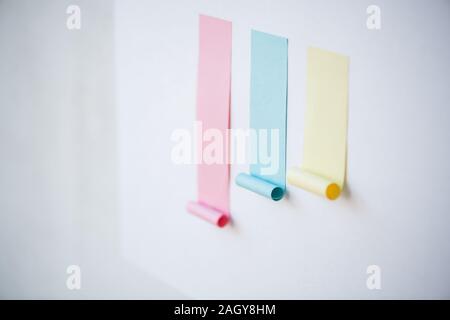 Colorful chart made up of blank pink and smaller blue and yellow sticky papers Stock Photo