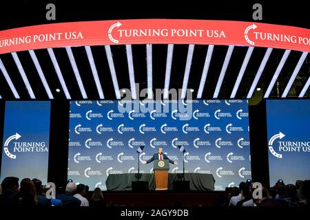 U.S President Donald Trump delivers remarks at the Turning Point USA 5th annual Student Action Summit at the Palm Beach County Convention Center December 21, 2019 in West Palm Beach, Florida. Trump rallied the youth conservative group with wild claims on wind turbines and attacks on his opponents. Stock Photo