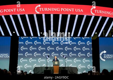 U.S President Donald Trump delivers remarks at the Turning Point USA 5th annual Student Action Summit at the Palm Beach County Convention Center December 21, 2019 in West Palm Beach, Florida. Trump rallied the youth conservative group with wild claims on wind turbines and attacks on his opponents. Stock Photo