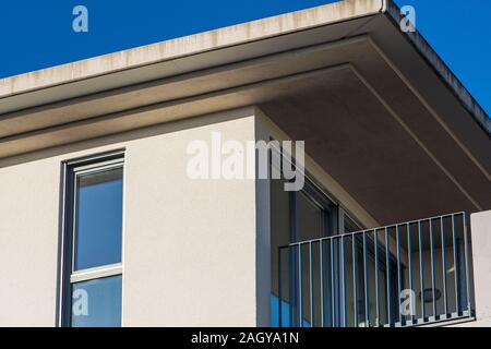 House facade with balcony and roof overhang Stock Photo