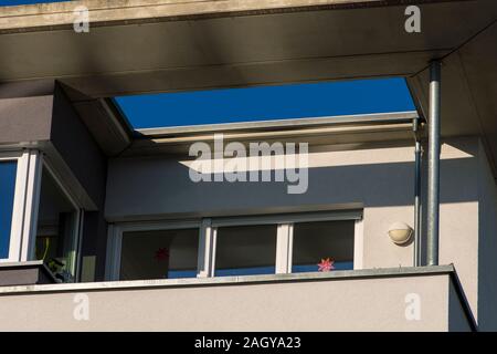 House facade with balcony and roof overhang Stock Photo