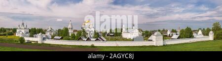 Panoramic view of the Pokrovsky monastery in spring day. Holy Intercession Convent in Suzdal. Panorama of old Russian monastery with fortified walls a Stock Photo