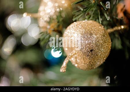 Decorated Christmas tree on blurred, sparkling and fairy background. Close up. Stock Photo