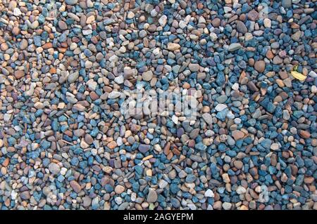Blue, grey, brown and white different small rocks, stones or gravel Stock Photo
