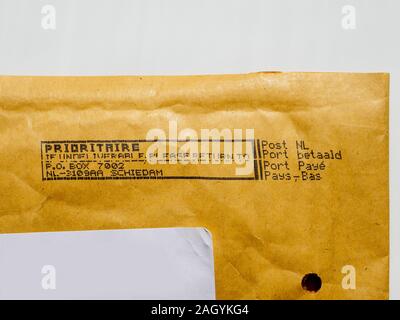 Amsterdam, Netherlands - Aug 9, 2017: Detail of business envelope from Post NL Netherlands postal service with Prioritaire stamp printed on dot matrix printer Stock Photo