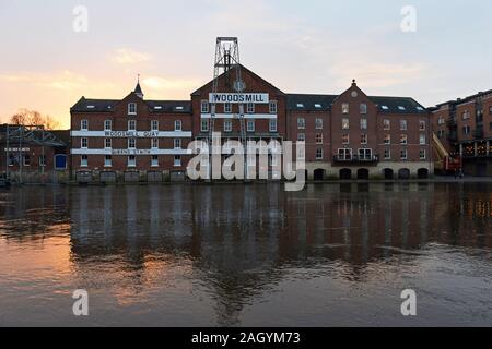 Buildings line the banks of the flooding river Ouse in York, UK Stock Photo