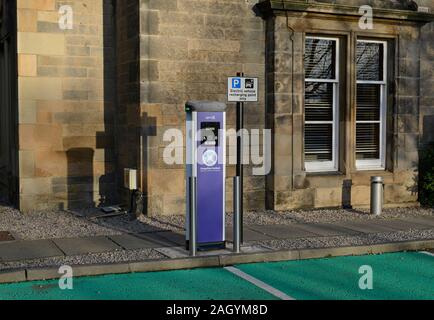 An electric car recharging facility with parking spaces at a residential building of Edinburgh University, Scotland, UK Stock Photo