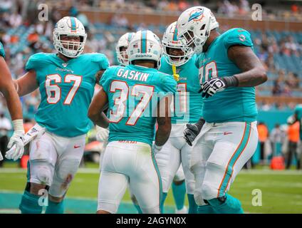 Miami Gardens, Florida, USA. 22nd Dec, 2019. Miami Dolphins running back Myles Gaskin (37) is congratulated by teammates after scoring a touchdown against the Cincinnati Bengals in the fourth quarter of an NFL football game at the Hard Rock Stadium in Miami Gardens, Florida. The Dolphins won 38-35. Credit: Mario Houben/ZUMA Wire/Alamy Live News Stock Photo