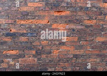 Interesting variations in brick colour in the wall of a building in Alnmouth, Northumberland, UK Stock Photo