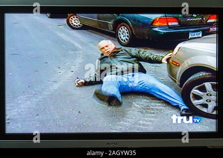 Miami Beach Florida,television,set,TV,flat panel,screen,monitor,cable channel,tru TV,adult adults man men male,car cars,accident,visitors travel trave Stock Photo