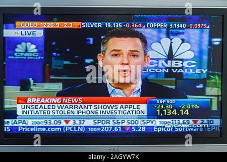 Miami Beach Florida,television,set,TV,flat panel,screen,monitor,cable channel,CNBC,stock market,man men male,journalist,reporter,media,interview,inter