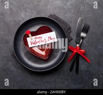 Valentines day or romantic dinner table setting over stone background. Top view flat lay Stock Photo