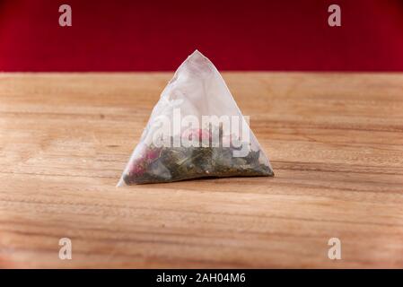 A pack of new cranberry green tea tea bags closeup Stock Photo