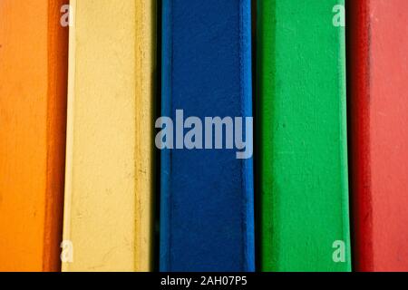 Wooden background from multi-colored boards arranged in a row. Stock Photo