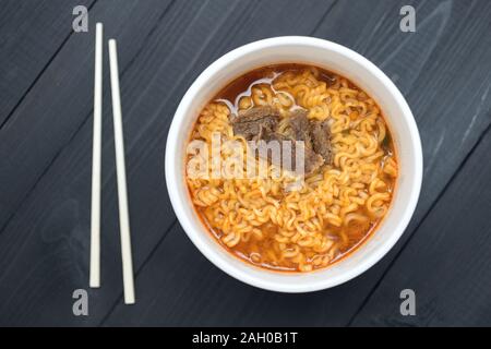 A bowl of Korean Japanese beef pork ramen, instant noodles close up Stock Photo
