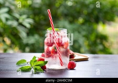 fresh Strawberry mohito cocktail with ice and mint in glass fruit to make water in the summer. Stock Photo