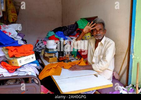 Portrait of senior men in tailor shop, Trichy, Tamil Nadu, India Stock Photo