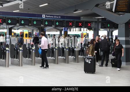 LONDON, UK - JULY 8, 2016: Passengers check in with contactless tickets at London Bridge railway station. With 47 million annual passengers, it's the Stock Photo