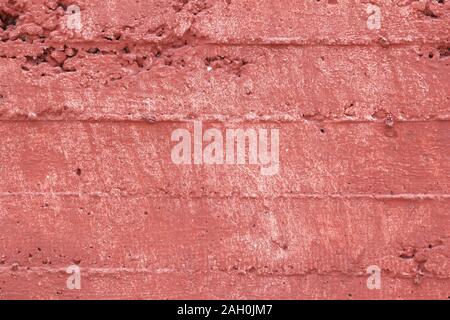 Red grunge wall background. Froly colored texture. Stock Photo