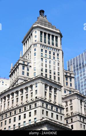 NEW YORK, USA - JULY 6, 2013: 26 Broadway Building exterior view in New York. The 520 ft building is owned by real estate firm Newmark Grubb Knight Fr Stock Photo