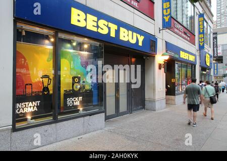 NEW YORK, USA - JULY 2, 2013: People walk by Best Buy store in New York. Best Buy is a consumer electronics store chain with 1,026 retail locations. Stock Photo