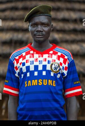 Portrait of a former soldier from Larim tribe wearing a chelsea football shirt, Boya Mountains, Imatong, South Sudan Stock Photo