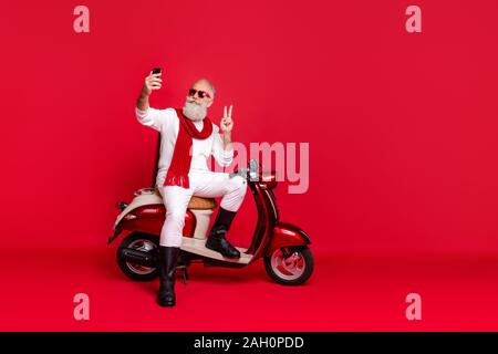 Portrait of his he nice attractive stylish trendy confident content optimistic gray-haired man taking making selfie showing v-sign isolated over Stock Photo