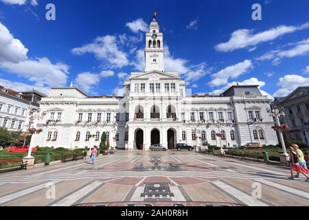 ARAD, ROMANIA - AUGUST 13, 2012: People visit the City Hall in Arad, Romania. Arad is the capital city of Arad County and 12th most populous Romanian Stock Photo