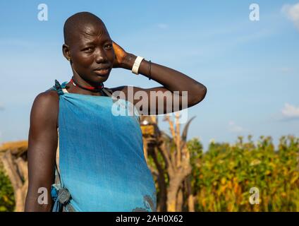 Portrait of a Mundari tribe woman in blue clothes, Central Equatoria, Terekeka, South Sudan Stock Photo