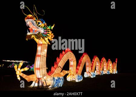 Warsaw, Poland - December 16, 2019: Dragon at Chinese Light Festival, traditional Chinese culture exhibition at night in Fort Bema Stock Photo