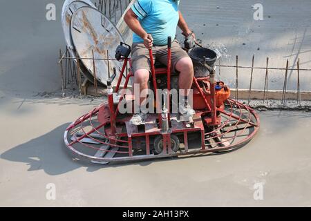 grinding machine on concrete floor of construction site Stock Photo