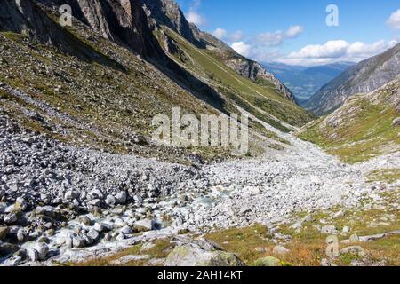 Alpine torrent, stones and rocks. View of Untersulzbach valley. Venediger group. Glacial alpine valley. Hohe Tauern National Park. Austrian Alps.