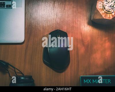 Bishkek, Kyrgyzstan - 29 August, 2017: Mouse Logitech MX Master with laptop and headphones Stock Photo