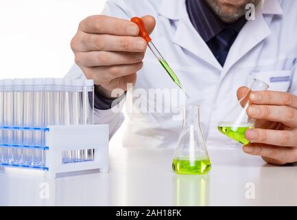 Researcher in the laboratory checks the chemical reactions of samples. Close up photo. Stock Photo