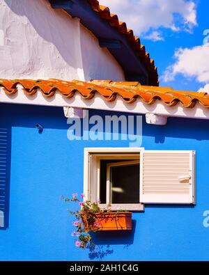 Window at blue residential house in Porto Cervo reflex Stock Photo