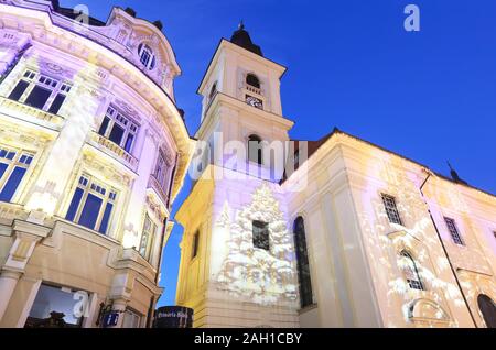 Christmas illuminations on the RC Holy Trinity Cathedral, on Piata Mare in Sibiu, Transylvania, Romania Stock Photo