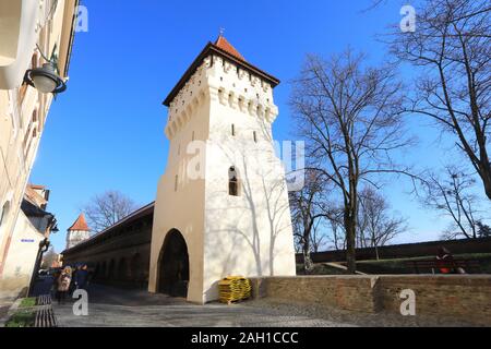 Winter sunshine on the medieval Potters Tower on Strada Cetatii in Sibiu's Old Town, in Transylvania, Romania Stock Photo