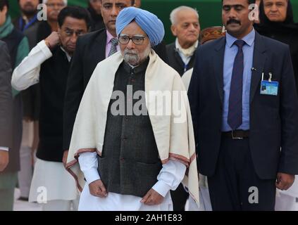 New Delhi, India. 23rd Dec, 2019. Former Indian Prime Minister Manmohan Singh (C, front) attends a congregation of senior leaders and party workers of the Indian National Congress (INC) in New Delhi, India, Dec. 23, 2019. India's main opposition party INC on Monday organised a congregation of senior leaders and party workers at 'Rajghat,' the memorial of Father of Nation Mahatma Gandhi, to take a pledge to uphold the country's Constitution, and oppose the new 'Citizenship (Amendment) Act (CAA).' Credit: Javed Dar/Xinhua/Alamy Live News Stock Photo